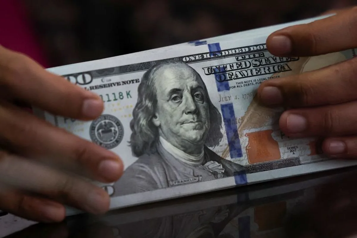 Dollar range-bound as markets price dovish Fed response